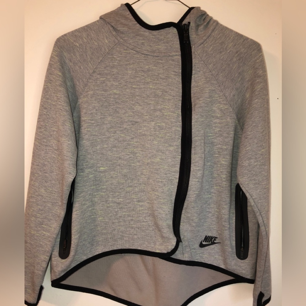 This is a girls large grey Nike zip up jacket w/lime green stripes
